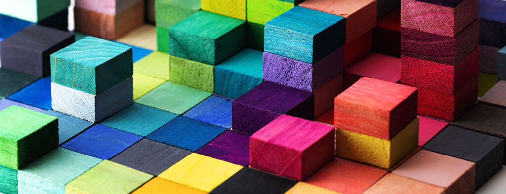 Spectrum of stacked multi-colored wooden blocks